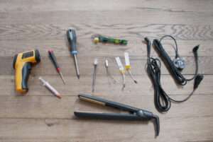 A variety of tools are laid out on the floor