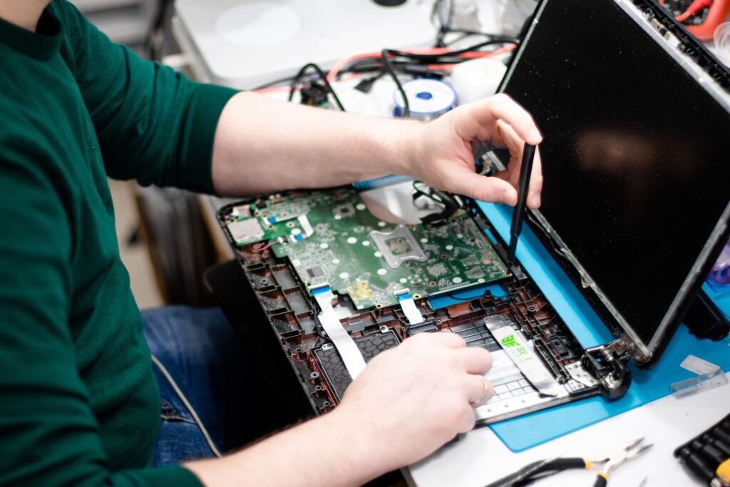 A man is working on a laptop computer